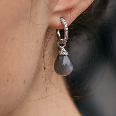 Moonstone and diamond pendants.