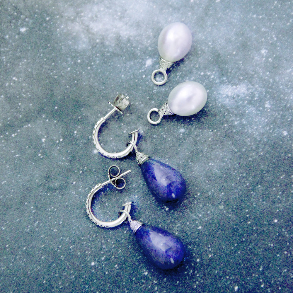 Pearl and diamond pendants.