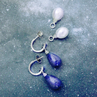 Pearl and diamond pendants.